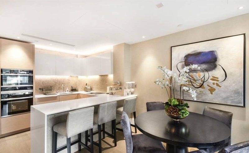Kitchen with breakfast bar and dining table