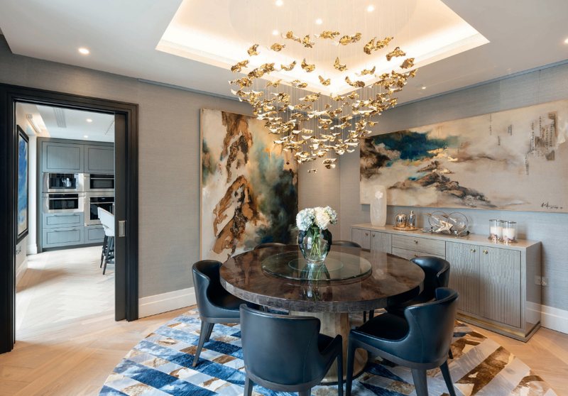 Dining room with round table and statement chandelier
