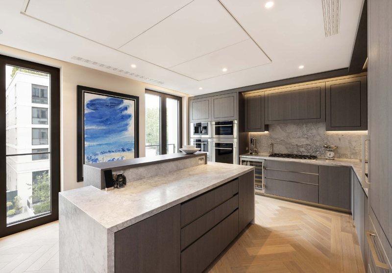 Kitchen with stone island and herringbone floor