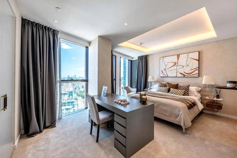 Bedroom with desk and artwork