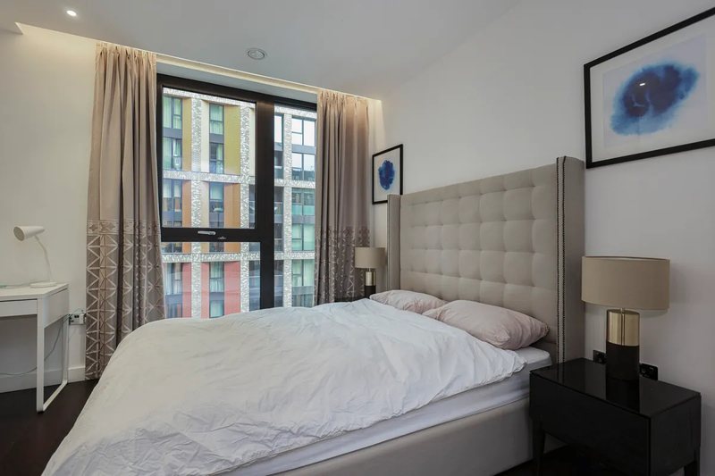Bedroom with upholstered headboard